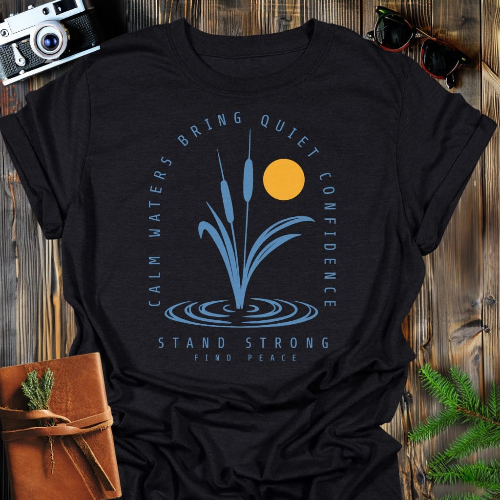 Calm Waters Bring Quiet Confidence Cattail Sunset T-Shirt In Black / S Lightweight adventure tee for outdoor lovers Perfect for hiking camping or road trips Made from soft breathable cotton for all-day comfort Ideal for nature lovers and adventurers FAYO Threads outdoor apparel remember Fun Awaits You Outside