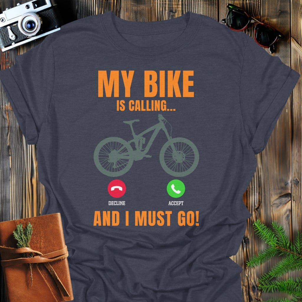 Bike Is Calling T-Shirt In Dark Heather / S Lightweight adventure tee for outdoor lovers Perfect for hiking camping or road trips Made from soft breathable cotton for all-day comfort Ideal for nature lovers and adventurers FAYO Threads outdoor apparel remember Fun Awaits You Outside