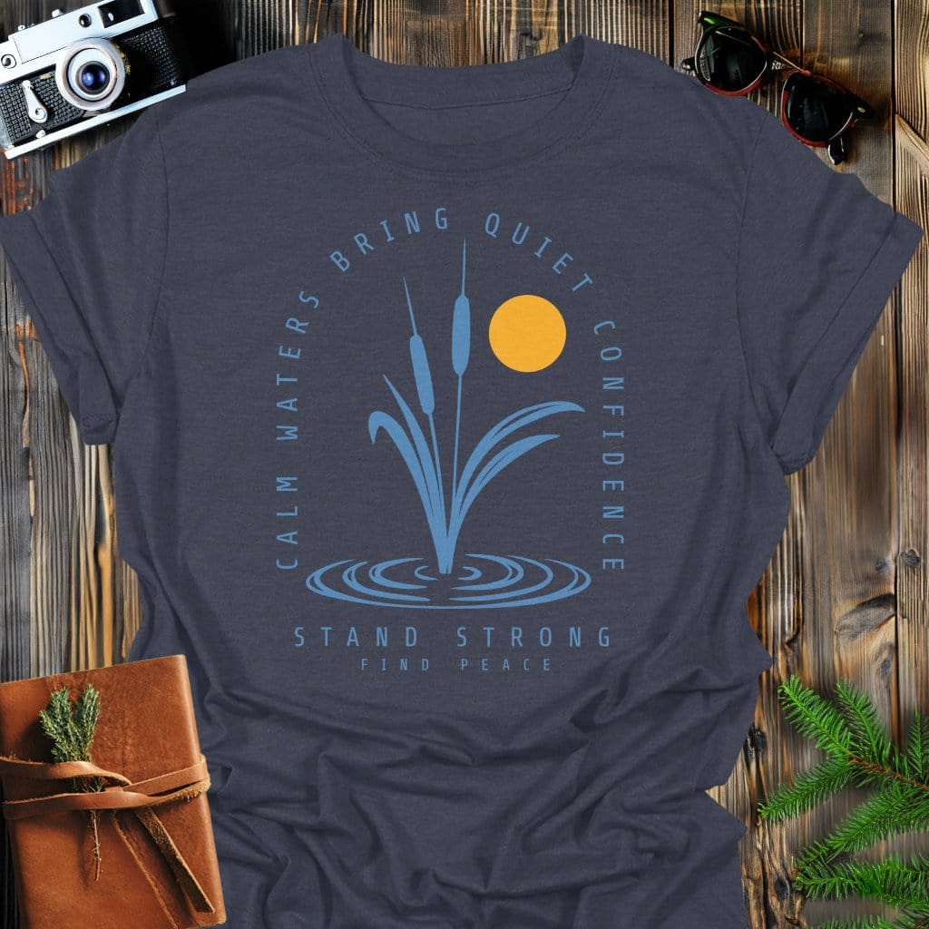 Calm Waters Bring Quiet Confidence Cattail Sunset T-Shirt In Dark Heather / S Lightweight adventure tee for outdoor lovers Perfect for hiking camping or road trips Made from soft breathable cotton for all-day comfort Ideal for nature lovers and adventurers FAYO Threads outdoor apparel remember Fun Awaits You Outside