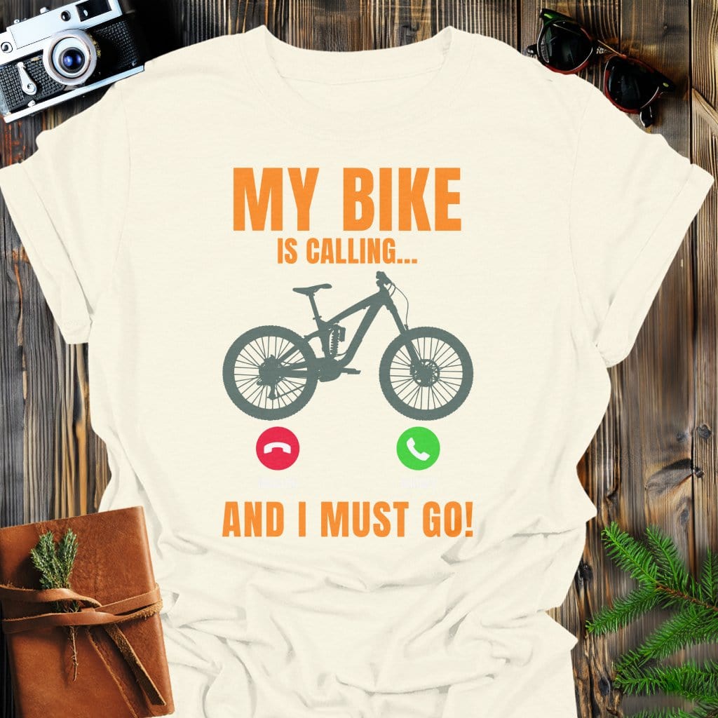 Bike Is Calling T-Shirt In Natural / S Lightweight adventure tee for outdoor lovers Perfect for hiking camping or road trips Made from soft breathable cotton for all-day comfort Ideal for nature lovers and adventurers FAYO Threads outdoor apparel remember Fun Awaits You Outside