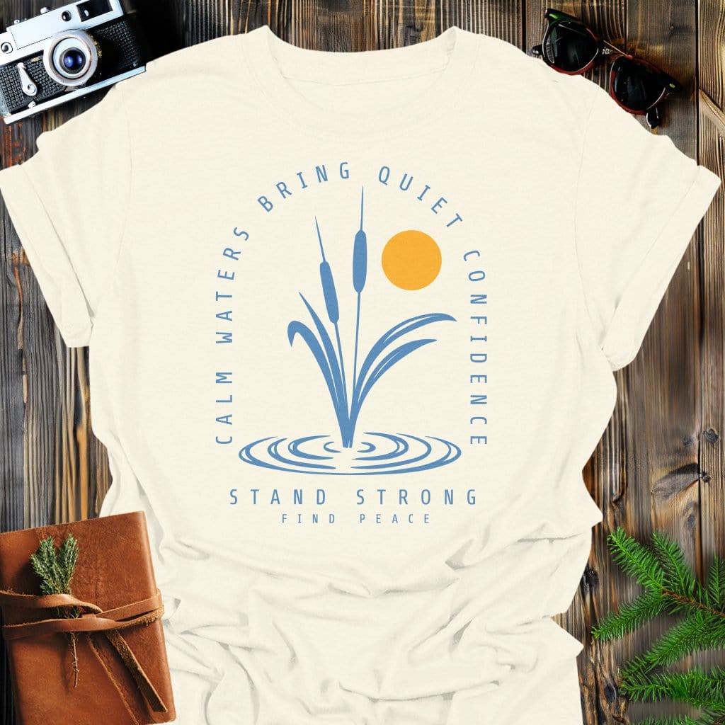 Calm Waters Bring Quiet Confidence Cattail Sunset T-Shirt In Natural / S Lightweight adventure tee for outdoor lovers Perfect for hiking camping or road trips Made from soft breathable cotton for all-day comfort Ideal for nature lovers and adventurers FAYO Threads outdoor apparel remember Fun Awaits You Outside