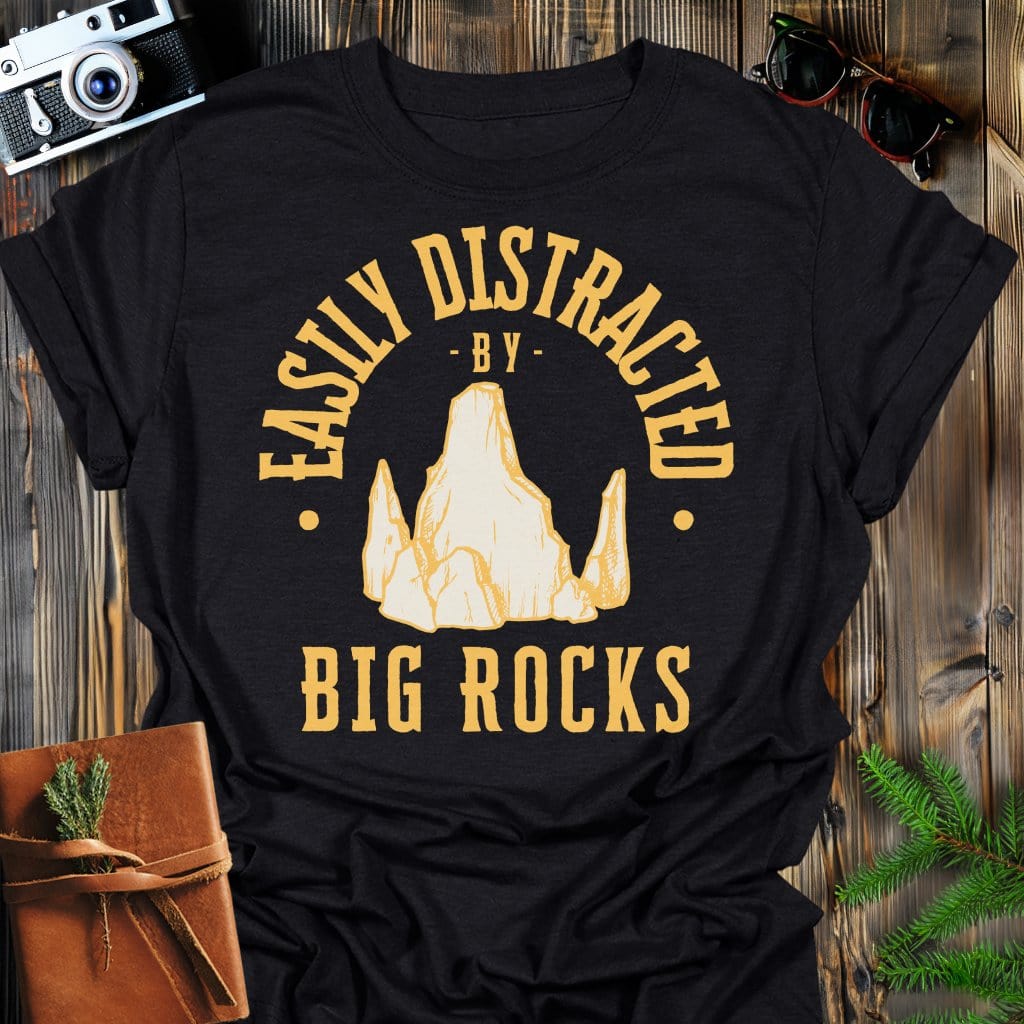 Distracted by Big Rocks T-Shirt In S / Black Lightweight adventure tee for outdoor lovers Perfect for hiking camping or road trips Made from soft breathable cotton for all-day comfort Ideal for nature lovers and adventurers FAYO Threads outdoor apparel remember Fun Awaits You Outside