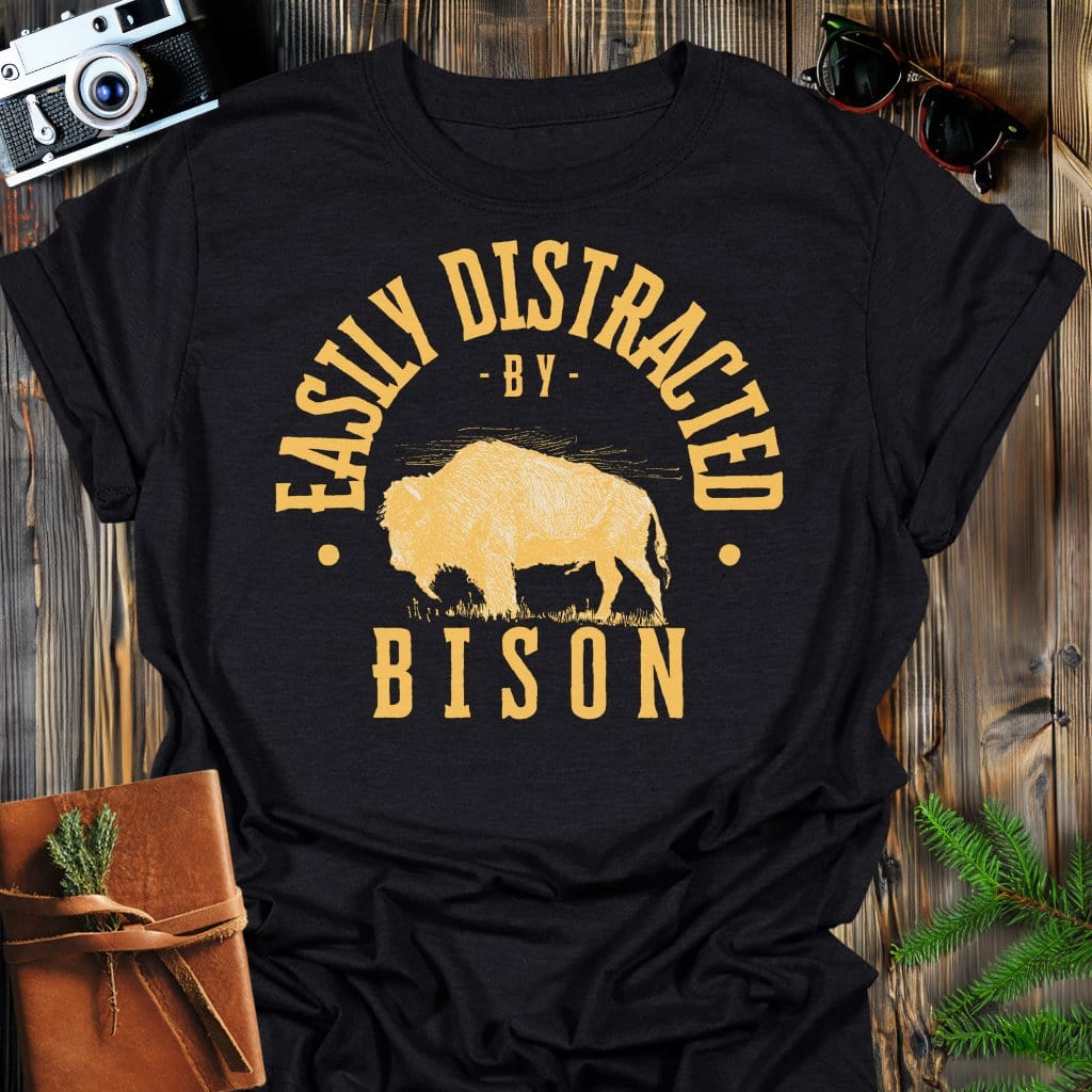 Distracted by Bison T-Shirt In S / Black Lightweight adventure tee for outdoor lovers Perfect for hiking camping or road trips Made from soft breathable cotton for all-day comfort Ideal for nature lovers and adventurers FAYO Threads outdoor apparel remember Fun Awaits You Outside