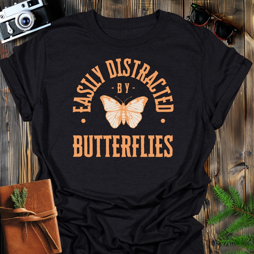 Distracted By Butterflies T-Shirt In S / Black Lightweight adventure tee for outdoor lovers Perfect for hiking camping or road trips Made from soft breathable cotton for all-day comfort Ideal for nature lovers and adventurers FAYO Threads outdoor apparel remember Fun Awaits You Outside