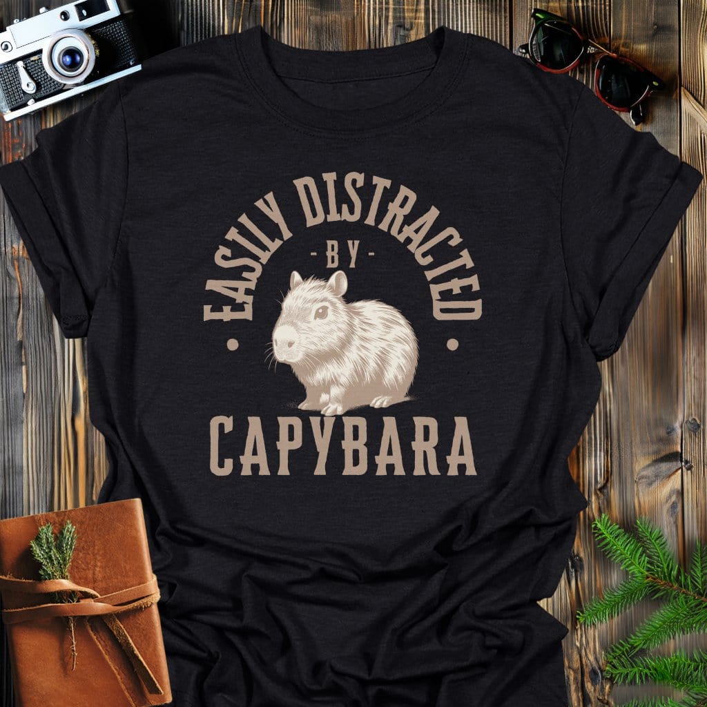 Distracted by Capybara T-Shirt In S / Black Lightweight adventure tee for outdoor lovers Perfect for hiking camping or road trips Made from soft breathable cotton for all-day comfort Ideal for nature lovers and adventurers FAYO Threads outdoor apparel remember Fun Awaits You Outside