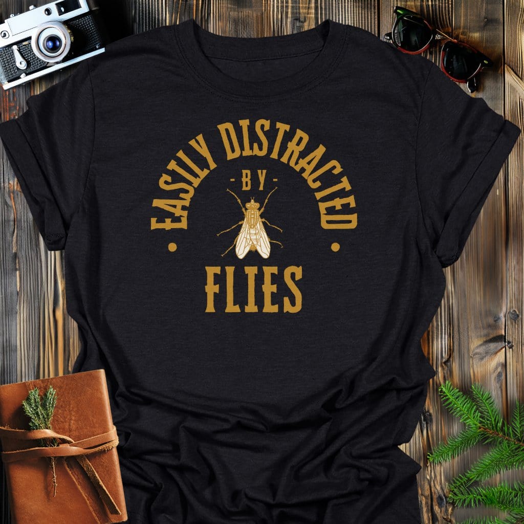 Distracted By Flies T-Shirt In S / Black Lightweight adventure tee for outdoor lovers Perfect for hiking camping or road trips Made from soft breathable cotton for all-day comfort Ideal for nature lovers and adventurers FAYO Threads outdoor apparel remember Fun Awaits You Outside
