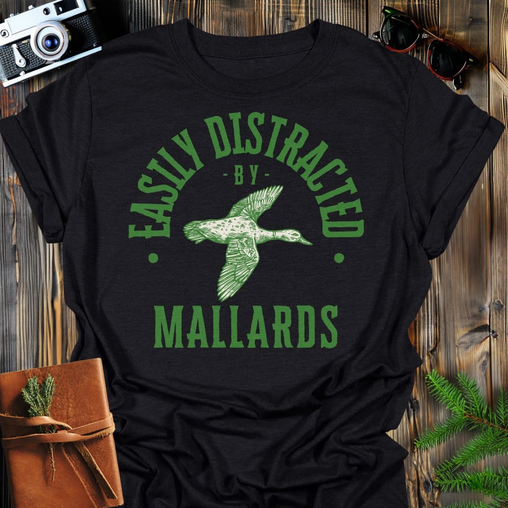 Distracted by Mallards T-Shirt In S / Black Lightweight adventure tee for outdoor lovers Perfect for hiking camping or road trips Made from soft breathable cotton for all-day comfort Ideal for nature lovers and adventurers FAYO Threads outdoor apparel remember Fun Awaits You Outside