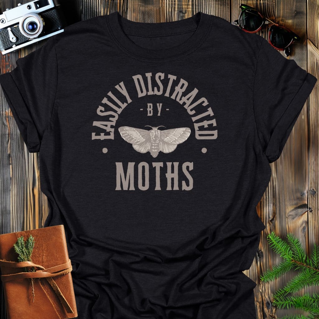 Distracted By Moths T-Shirt In S / Black Lightweight adventure tee for outdoor lovers Perfect for hiking camping or road trips Made from soft breathable cotton for all-day comfort Ideal for nature lovers and adventurers FAYO Threads outdoor apparel remember Fun Awaits You Outside
