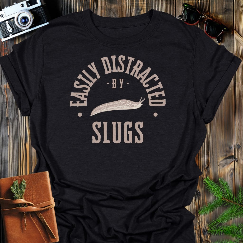 Distracted By Slugs T-Shirt In S / Black Lightweight adventure tee for outdoor lovers Perfect for hiking camping or road trips Made from soft breathable cotton for all-day comfort Ideal for nature lovers and adventurers FAYO Threads outdoor apparel remember Fun Awaits You Outside