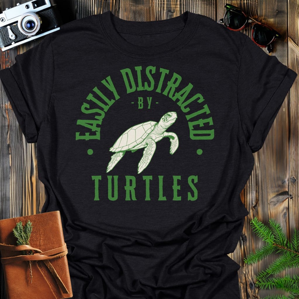 Distracted by Turtles T-Shirt In S / Black Lightweight adventure tee for outdoor lovers Perfect for hiking camping or road trips Made from soft breathable cotton for all-day comfort Ideal for nature lovers and adventurers FAYO Threads outdoor apparel remember Fun Awaits You Outside