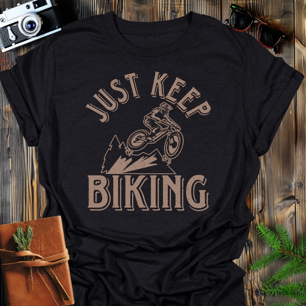 Just Keep Biking T-Shirt In Black / S Lightweight adventure tee for outdoor lovers Perfect for hiking camping or road trips Made from soft breathable cotton for all-day comfort Ideal for nature lovers and adventurers FAYO Threads outdoor apparel remember Fun Awaits You Outside
