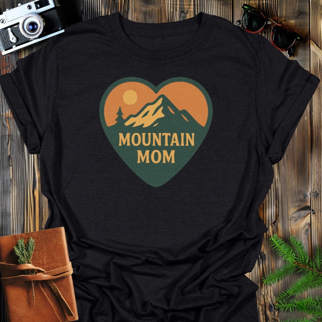 Mountain Mom Heart T-Shirt In S / Black Lightweight adventure tee for outdoor lovers Perfect for hiking camping or road trips Made from soft breathable cotton for all-day comfort Ideal for nature lovers and adventurers FAYO Threads outdoor apparel remember Fun Awaits You Outside