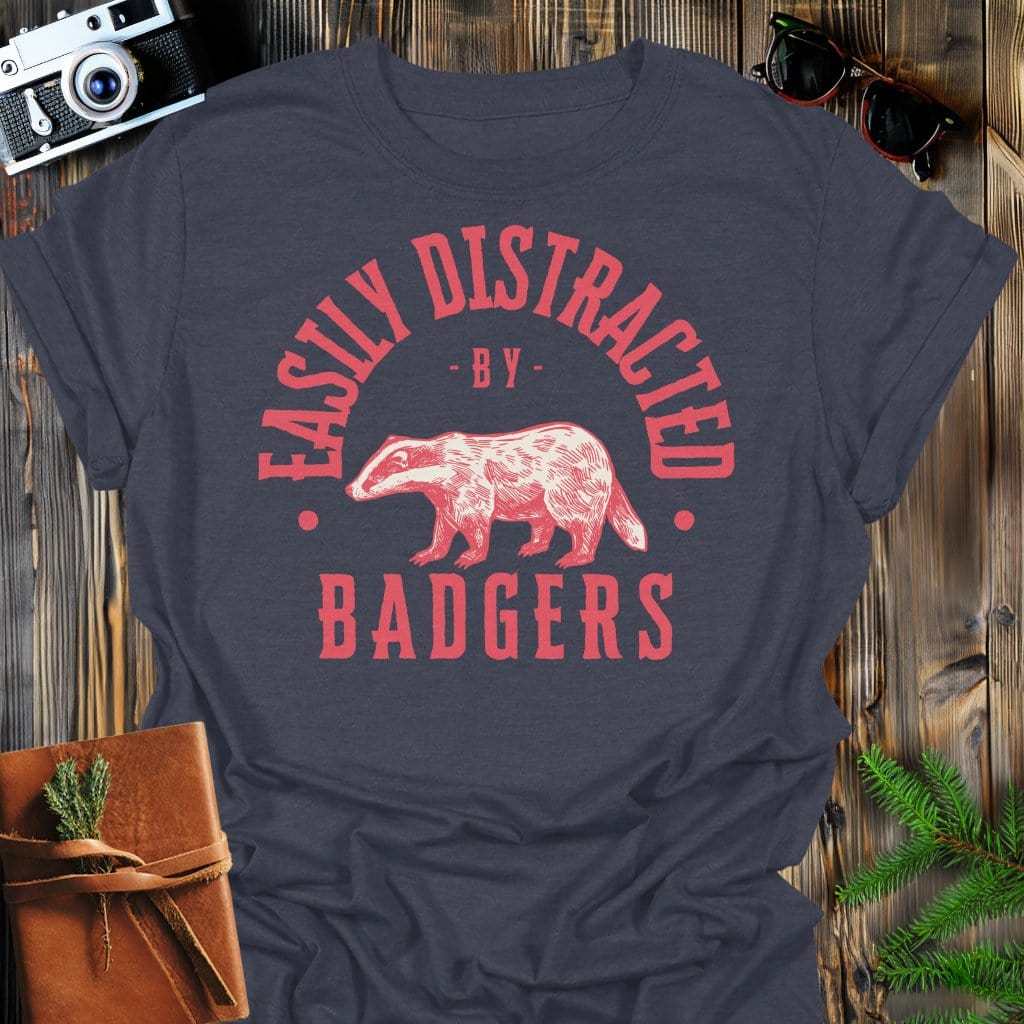 Distracted by Badgers T-Shirt In S / Dark Heather Lightweight adventure tee for outdoor lovers Perfect for hiking camping or road trips Made from soft breathable cotton for all-day comfort Ideal for nature lovers and adventurers FAYO Threads outdoor apparel remember Fun Awaits You Outside