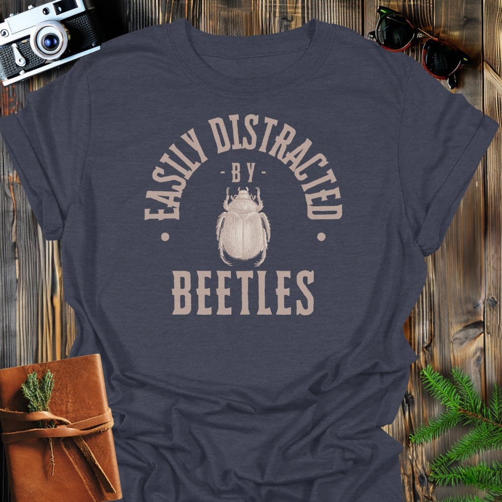 Distracted By Beetles T-Shirt In S / Dark Heather Lightweight adventure tee for outdoor lovers Perfect for hiking camping or road trips Made from soft breathable cotton for all-day comfort Ideal for nature lovers and adventurers FAYO Threads outdoor apparel remember Fun Awaits You Outside