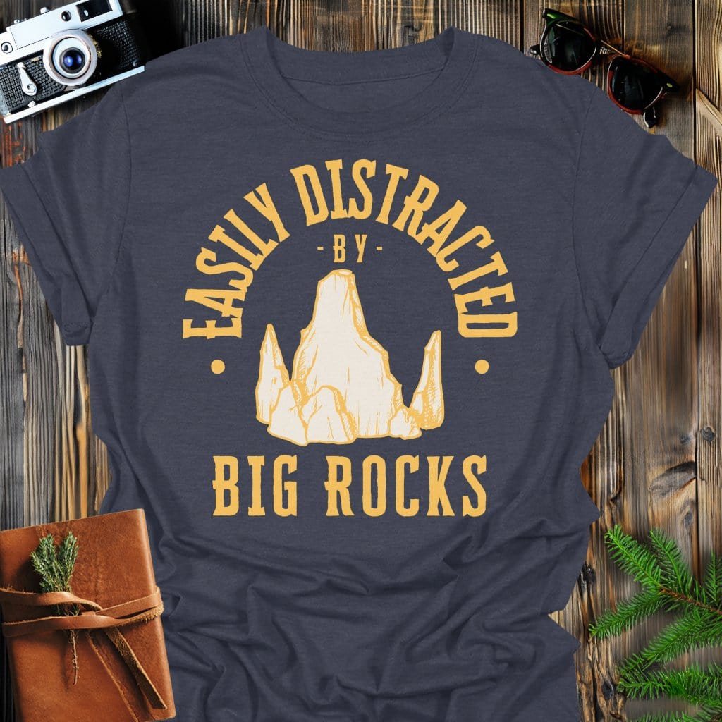 Distracted by Big Rocks T-Shirt In S / Dark Heather Lightweight adventure tee for outdoor lovers Perfect for hiking camping or road trips Made from soft breathable cotton for all-day comfort Ideal for nature lovers and adventurers FAYO Threads outdoor apparel remember Fun Awaits You Outside