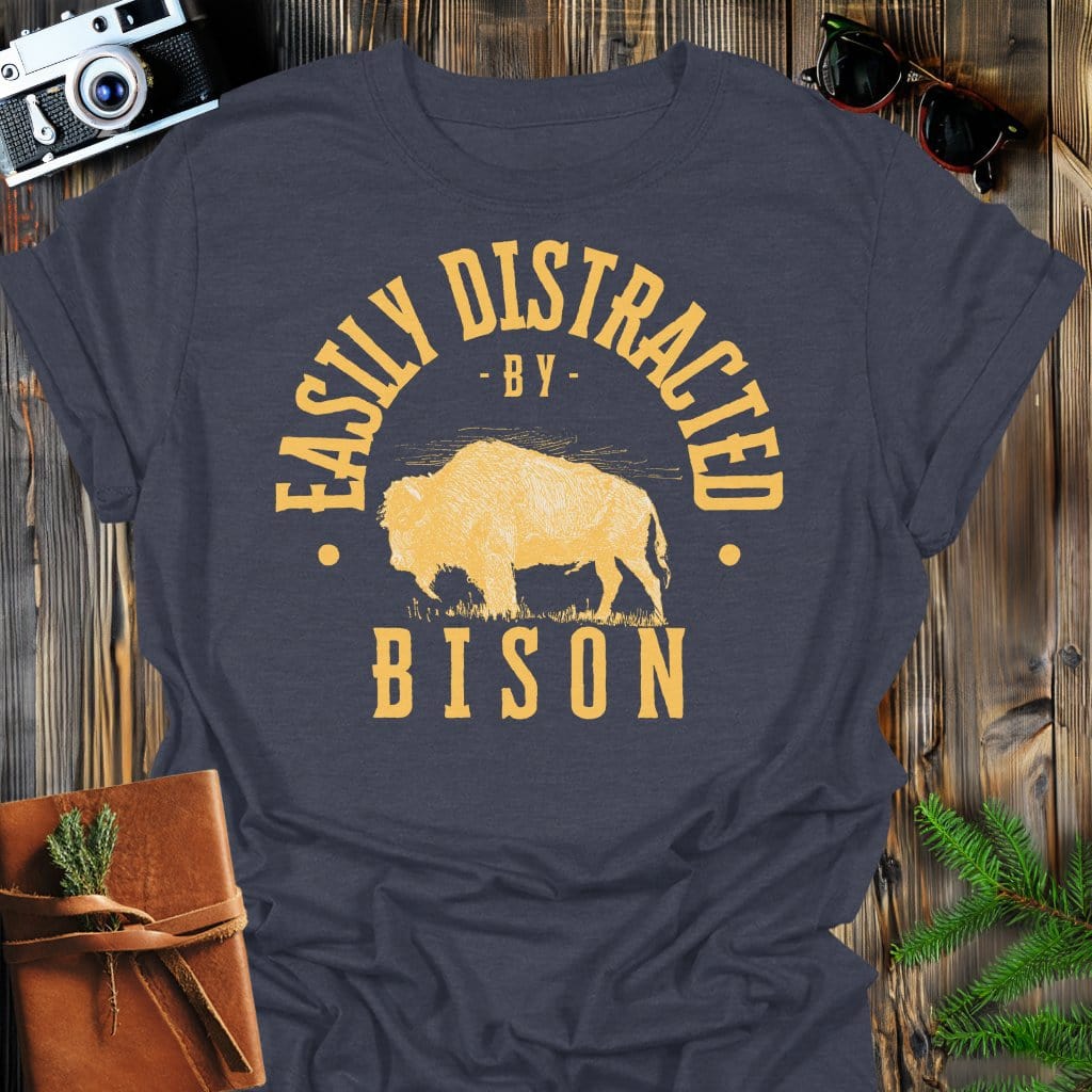 Distracted by Bison T-Shirt In S / Dark Heather Lightweight adventure tee for outdoor lovers Perfect for hiking camping or road trips Made from soft breathable cotton for all-day comfort Ideal for nature lovers and adventurers FAYO Threads outdoor apparel remember Fun Awaits You Outside