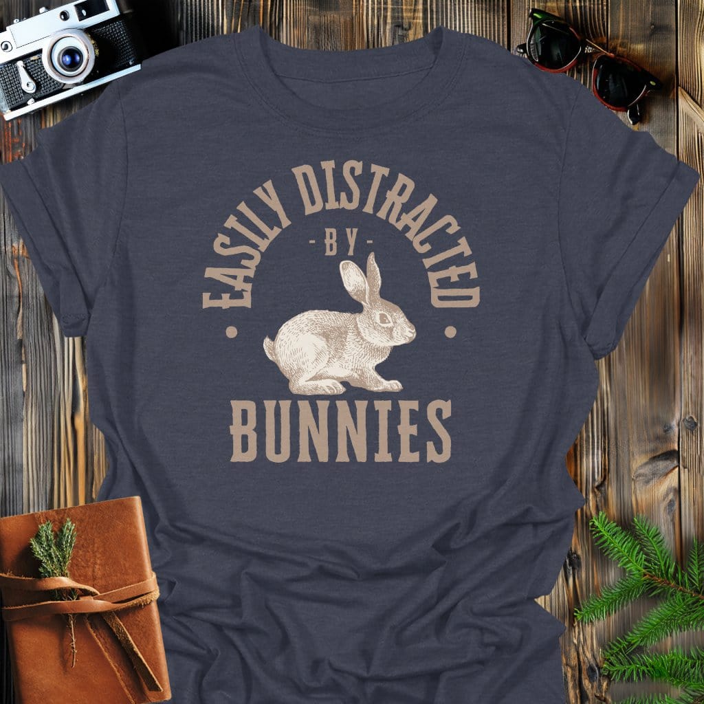 Distracted By Bunnies T-Shirt In S / Dark Heather Lightweight adventure tee for outdoor lovers Perfect for hiking camping or road trips Made from soft breathable cotton for all-day comfort Ideal for nature lovers and adventurers FAYO Threads outdoor apparel remember Fun Awaits You Outside