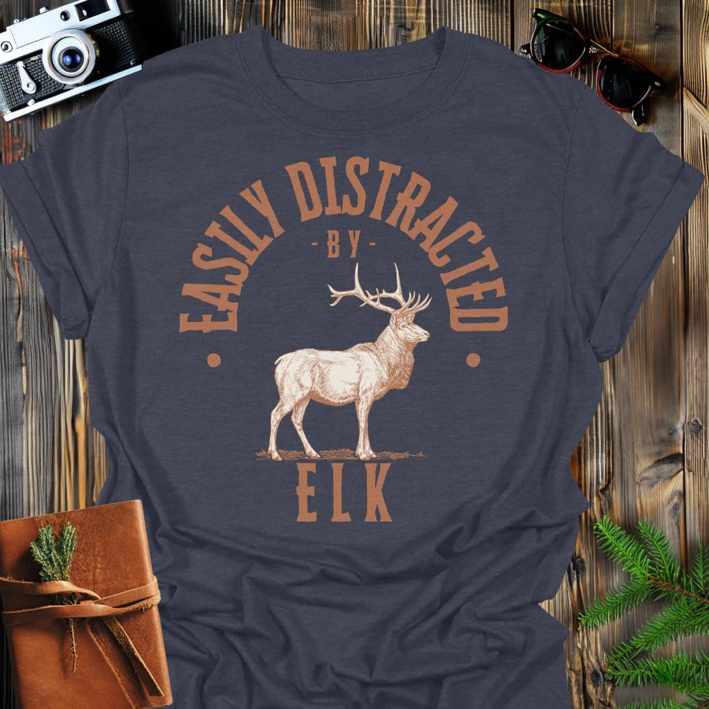 Distracted by Elk T-Shirt In S / Dark Heather Lightweight adventure tee for outdoor lovers Perfect for hiking camping or road trips Made from soft breathable cotton for all-day comfort Ideal for nature lovers and adventurers FAYO Threads outdoor apparel remember Fun Awaits You Outside