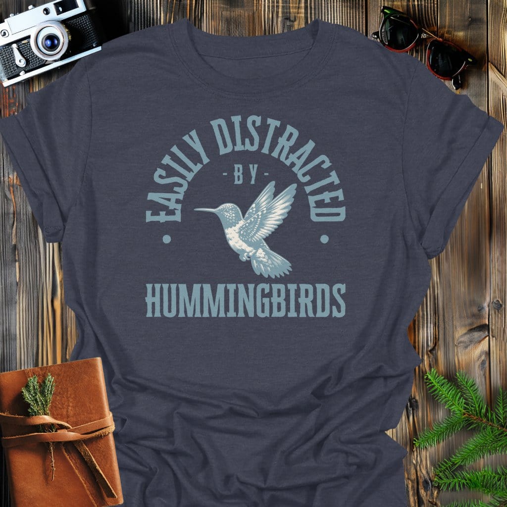 Distracted By Hummingbirds T-Shirt In S / Dark Heather Lightweight adventure tee for outdoor lovers Perfect for hiking camping or road trips Made from soft breathable cotton for all-day comfort Ideal for nature lovers and adventurers FAYO Threads outdoor apparel remember Fun Awaits You Outside