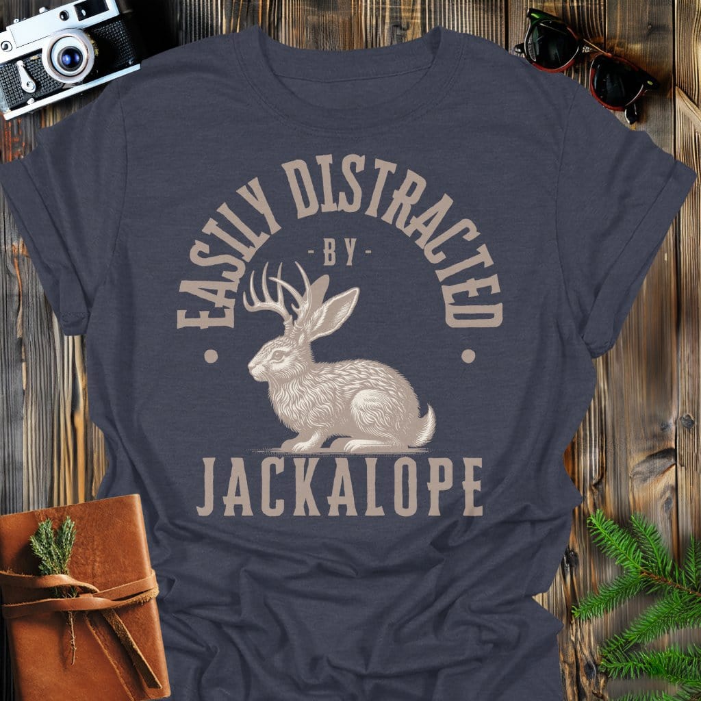Distracted by Jackalope T-Shirt In S / Dark Heather Lightweight adventure tee for outdoor lovers Perfect for hiking camping or road trips Made from soft breathable cotton for all-day comfort Ideal for nature lovers and adventurers FAYO Threads outdoor apparel remember Fun Awaits You Outside
