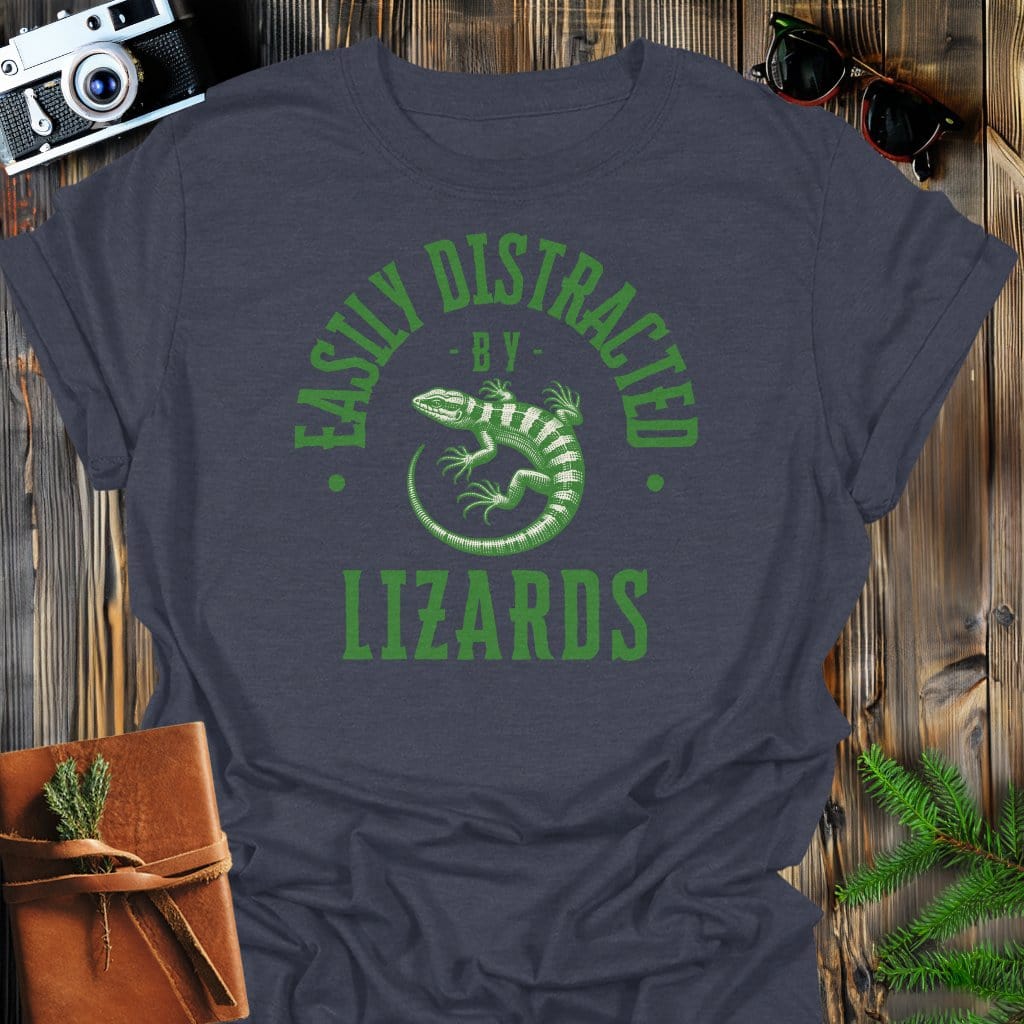 Distracted By Lizards T-Shirt In S / Dark Heather Lightweight adventure tee for outdoor lovers Perfect for hiking camping or road trips Made from soft breathable cotton for all-day comfort Ideal for nature lovers and adventurers FAYO Threads outdoor apparel remember Fun Awaits You Outside