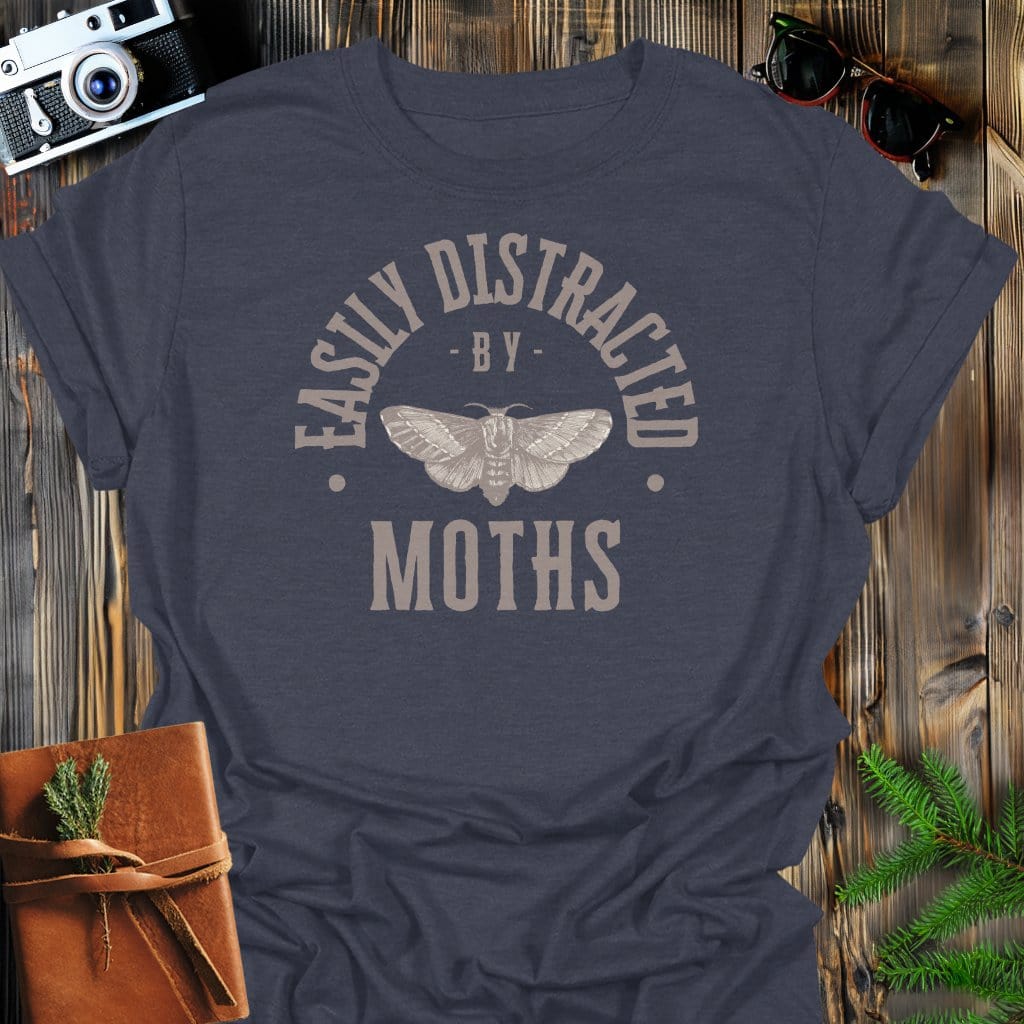 Distracted By Moths T-Shirt In S / Dark Heather Lightweight adventure tee for outdoor lovers Perfect for hiking camping or road trips Made from soft breathable cotton for all-day comfort Ideal for nature lovers and adventurers FAYO Threads outdoor apparel remember Fun Awaits You Outside