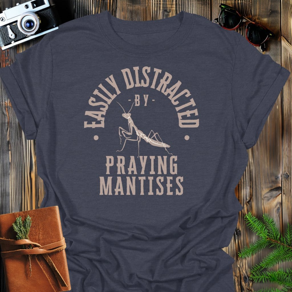 Distracted By Praying Matises T-Shirt In S / Dark Heather Lightweight adventure tee for outdoor lovers Perfect for hiking camping or road trips Made from soft breathable cotton for all-day comfort Ideal for nature lovers and adventurers FAYO Threads outdoor apparel remember Fun Awaits You Outside