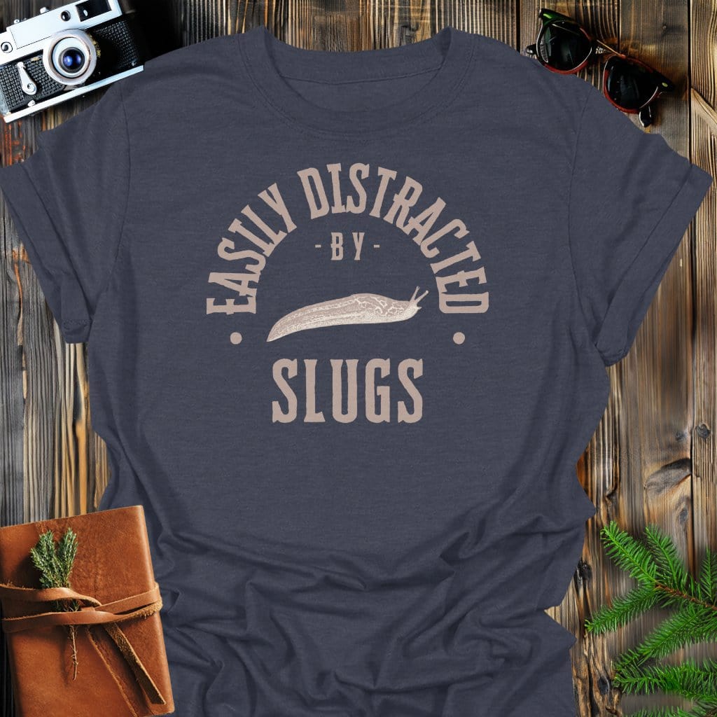 Distracted By Slugs T-Shirt In S / Dark Heather Lightweight adventure tee for outdoor lovers Perfect for hiking camping or road trips Made from soft breathable cotton for all-day comfort Ideal for nature lovers and adventurers FAYO Threads outdoor apparel remember Fun Awaits You Outside
