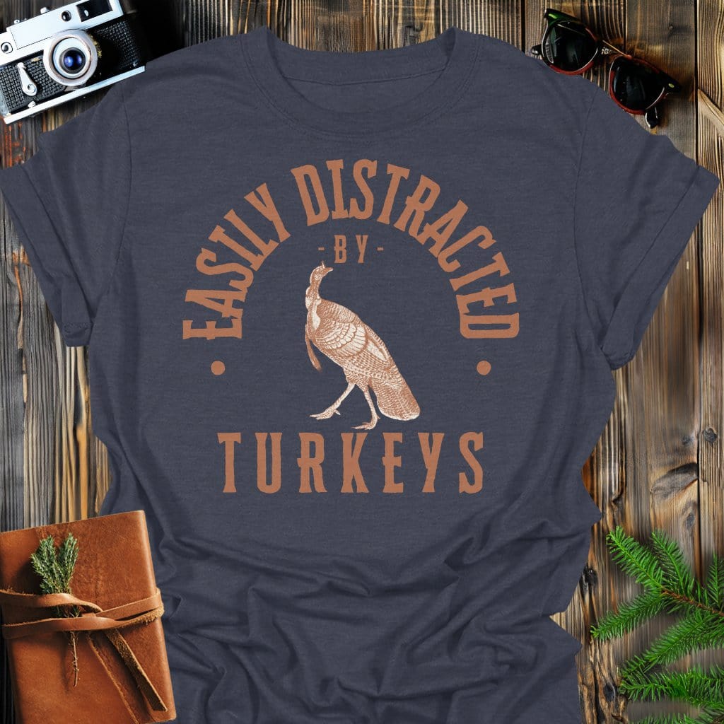 Distracted by Turkeys T-Shirt In S / Dark Heather Lightweight adventure tee for outdoor lovers Perfect for hiking camping or road trips Made from soft breathable cotton for all-day comfort Ideal for nature lovers and adventurers FAYO Threads outdoor apparel remember Fun Awaits You Outside