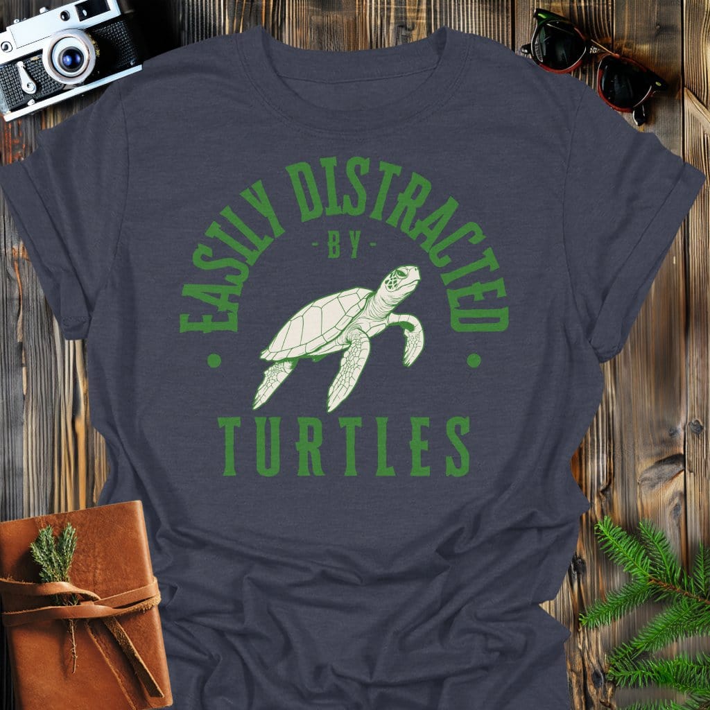 Distracted by Turtles T-Shirt In S / Dark Heather Lightweight adventure tee for outdoor lovers Perfect for hiking camping or road trips Made from soft breathable cotton for all-day comfort Ideal for nature lovers and adventurers FAYO Threads outdoor apparel remember Fun Awaits You Outside