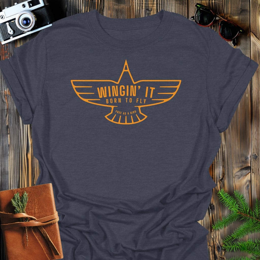 Wingin' It T-Shirt In Dark Heather / S Lightweight adventure tee for outdoor lovers Perfect for hiking camping or road trips Made from soft breathable cotton for all-day comfort Ideal for nature lovers and adventurers FAYO Threads outdoor apparel remember Fun Awaits You Outside