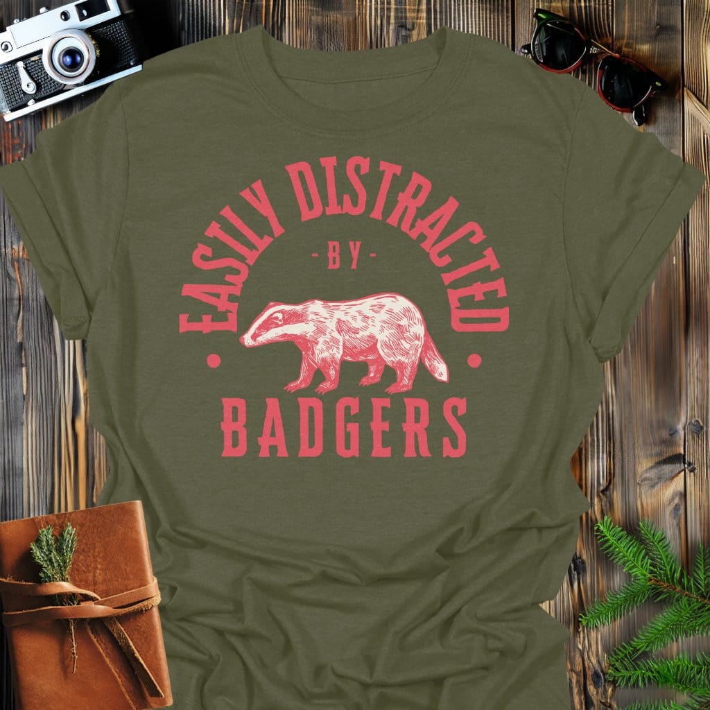 Distracted by Badgers T-Shirt In S / Military Green Lightweight adventure tee for outdoor lovers Perfect for hiking camping or road trips Made from soft breathable cotton for all-day comfort Ideal for nature lovers and adventurers FAYO Threads outdoor apparel remember Fun Awaits You Outside