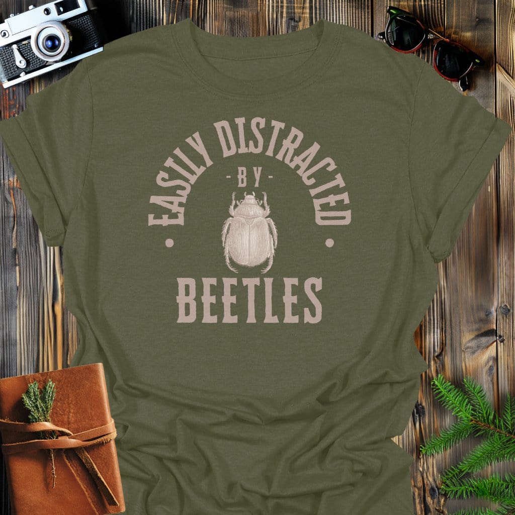 Distracted By Beetles T-Shirt In S / Military Green Lightweight adventure tee for outdoor lovers Perfect for hiking camping or road trips Made from soft breathable cotton for all-day comfort Ideal for nature lovers and adventurers FAYO Threads outdoor apparel remember Fun Awaits You Outside