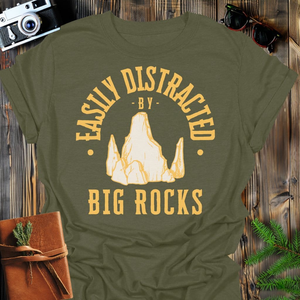 Distracted by Big Rocks T-Shirt In S / Military Green Lightweight adventure tee for outdoor lovers Perfect for hiking camping or road trips Made from soft breathable cotton for all-day comfort Ideal for nature lovers and adventurers FAYO Threads outdoor apparel remember Fun Awaits You Outside