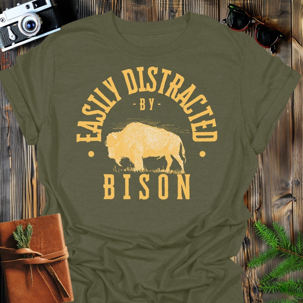 Distracted by Bison T-Shirt In S / Military Green Lightweight adventure tee for outdoor lovers Perfect for hiking camping or road trips Made from soft breathable cotton for all-day comfort Ideal for nature lovers and adventurers FAYO Threads outdoor apparel remember Fun Awaits You Outside