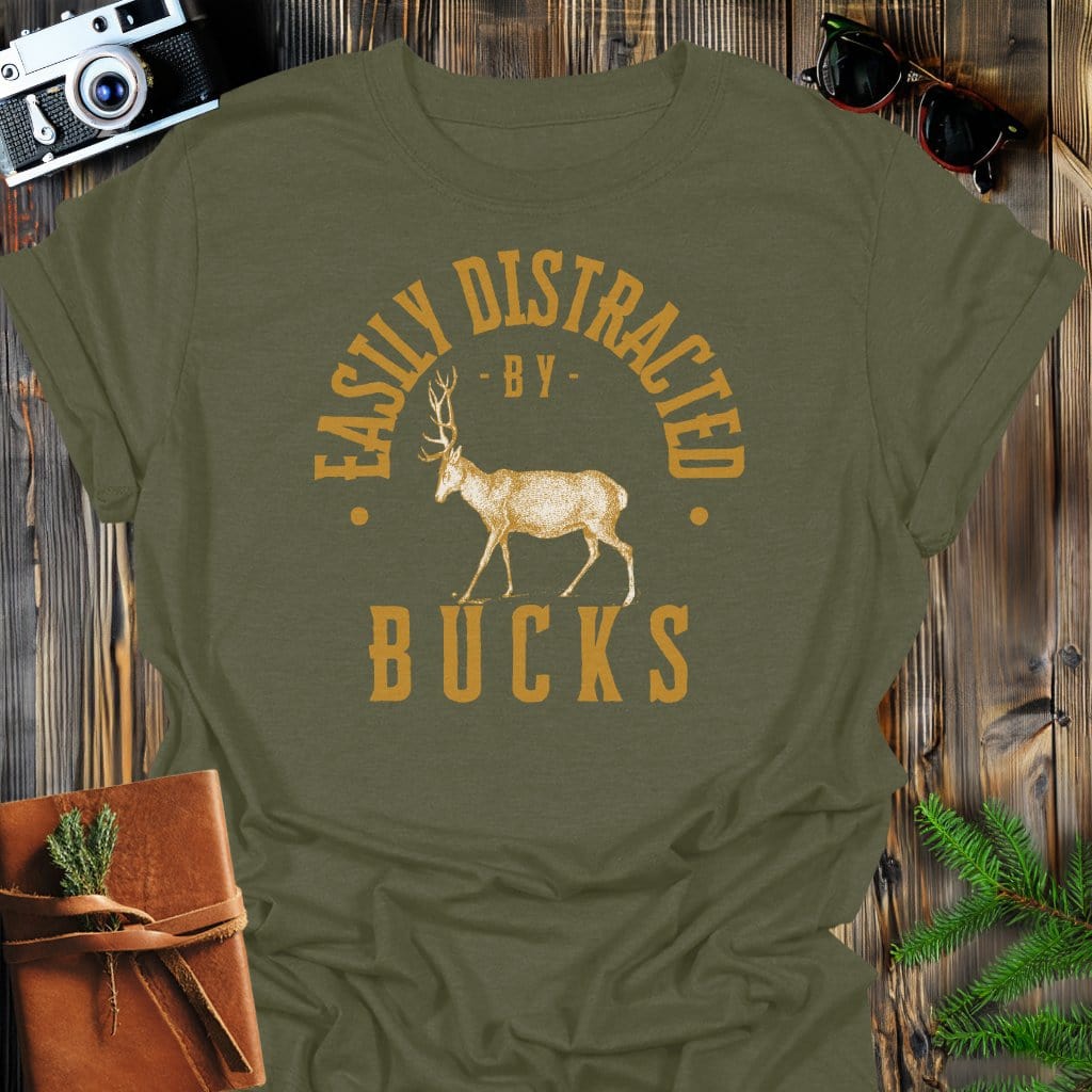 Distracted By Bucks T-Shirt In S / Military Green Lightweight adventure tee for outdoor lovers Perfect for hiking camping or road trips Made from soft breathable cotton for all-day comfort Ideal for nature lovers and adventurers FAYO Threads outdoor apparel remember Fun Awaits You Outside