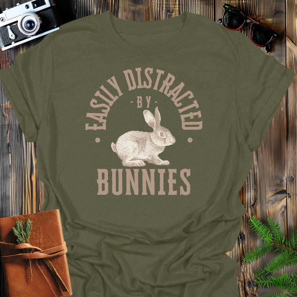 Distracted By Bunnies T-Shirt In S / Military Green Lightweight adventure tee for outdoor lovers Perfect for hiking camping or road trips Made from soft breathable cotton for all-day comfort Ideal for nature lovers and adventurers FAYO Threads outdoor apparel remember Fun Awaits You Outside