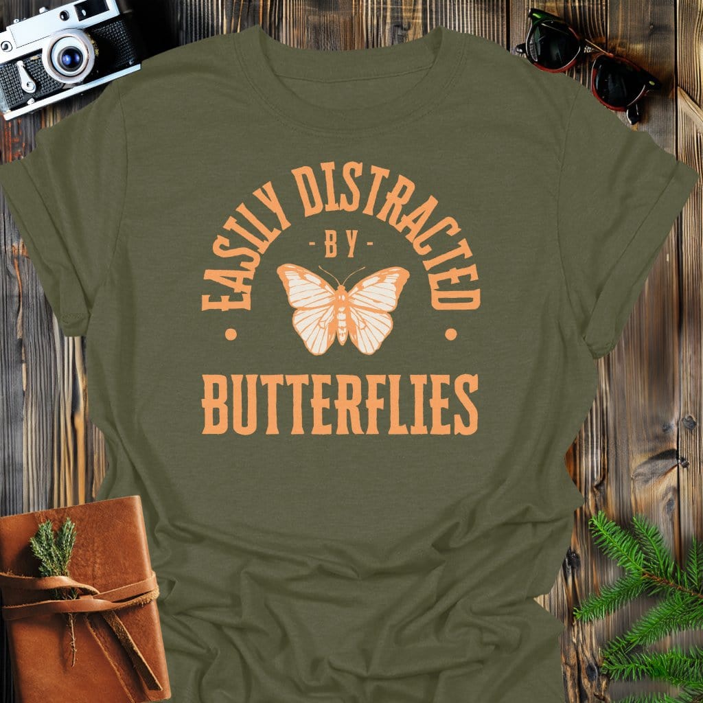 Distracted By Butterflies T-Shirt In S / Military Green Lightweight adventure tee for outdoor lovers Perfect for hiking camping or road trips Made from soft breathable cotton for all-day comfort Ideal for nature lovers and adventurers FAYO Threads outdoor apparel remember Fun Awaits You Outside