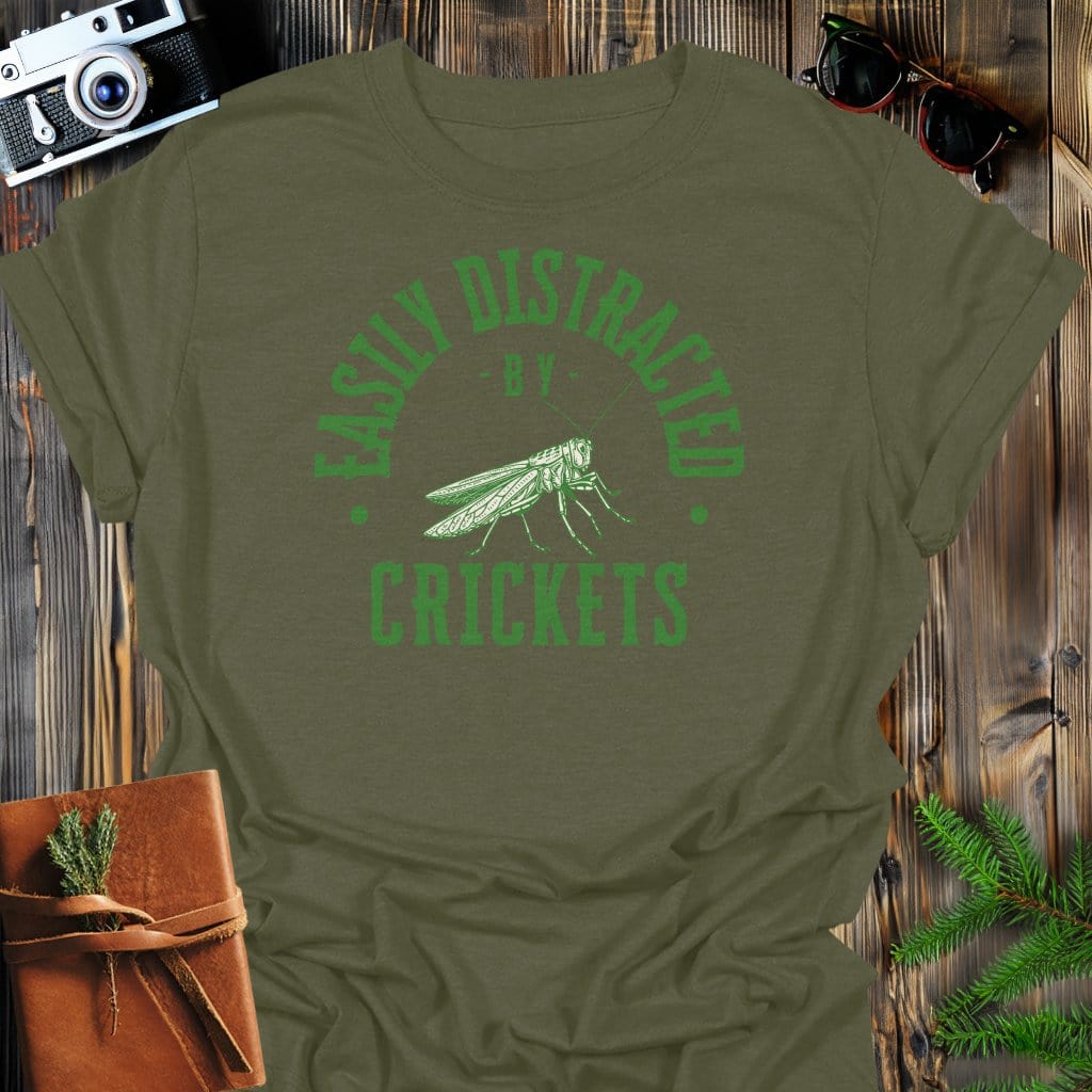 Distracted By Crickets T-Shirt In S / Military Green Lightweight adventure tee for outdoor lovers Perfect for hiking camping or road trips Made from soft breathable cotton for all-day comfort Ideal for nature lovers and adventurers FAYO Threads outdoor apparel remember Fun Awaits You Outside