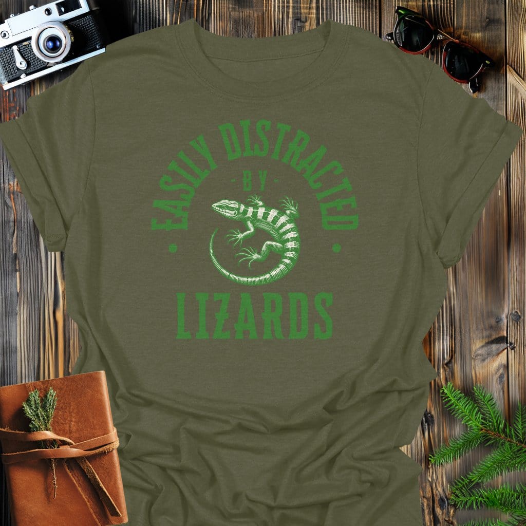 Distracted By Lizards T-Shirt In S / Military Green Lightweight adventure tee for outdoor lovers Perfect for hiking camping or road trips Made from soft breathable cotton for all-day comfort Ideal for nature lovers and adventurers FAYO Threads outdoor apparel remember Fun Awaits You Outside