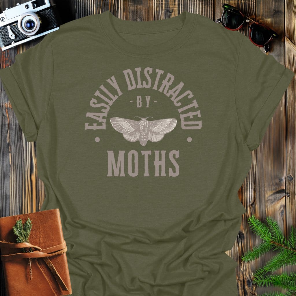 Distracted By Moths T-Shirt In S / Military Green Lightweight adventure tee for outdoor lovers Perfect for hiking camping or road trips Made from soft breathable cotton for all-day comfort Ideal for nature lovers and adventurers FAYO Threads outdoor apparel remember Fun Awaits You Outside