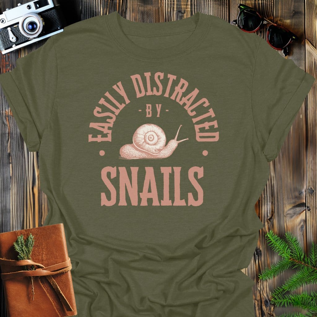 Distracted By Snails T-Shirt In S / Military Green Lightweight adventure tee for outdoor lovers Perfect for hiking camping or road trips Made from soft breathable cotton for all-day comfort Ideal for nature lovers and adventurers FAYO Threads outdoor apparel remember Fun Awaits You Outside