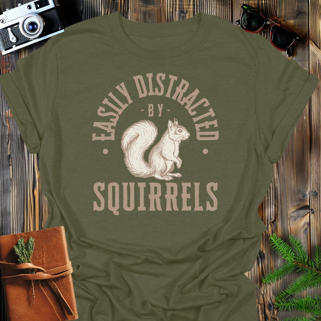 Distracted By Squirrels T-Shirt In S / Military Green Lightweight adventure tee for outdoor lovers Perfect for hiking camping or road trips Made from soft breathable cotton for all-day comfort Ideal for nature lovers and adventurers FAYO Threads outdoor apparel remember Fun Awaits You Outside