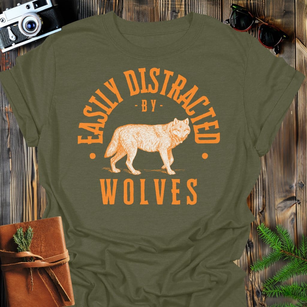 Distracted by Wolves T-Shirt In S / Military Green Lightweight adventure tee for outdoor lovers Perfect for hiking camping or road trips Made from soft breathable cotton for all-day comfort Ideal for nature lovers and adventurers FAYO Threads outdoor apparel remember Fun Awaits You Outside
