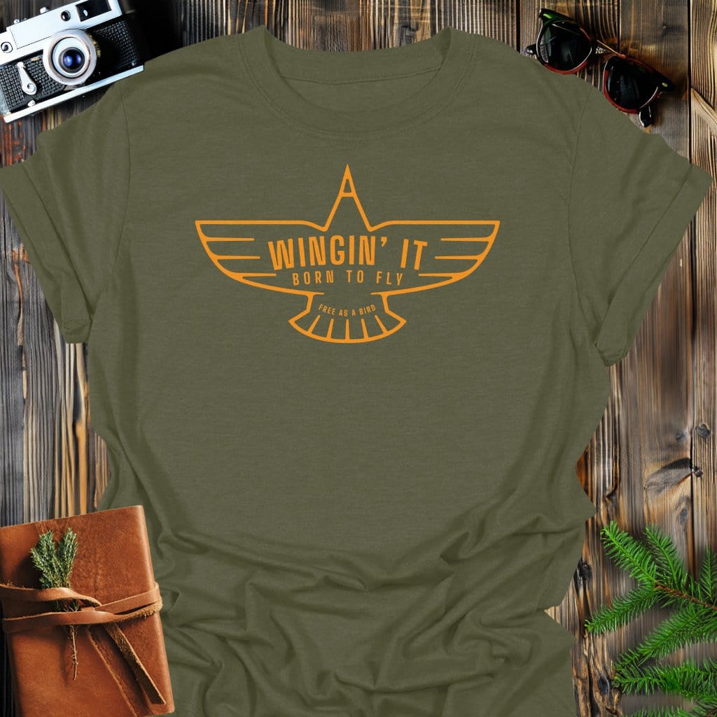 Wingin' It T-Shirt In Military Green / S Lightweight adventure tee for outdoor lovers Perfect for hiking camping or road trips Made from soft breathable cotton for all-day comfort Ideal for nature lovers and adventurers FAYO Threads outdoor apparel remember Fun Awaits You Outside