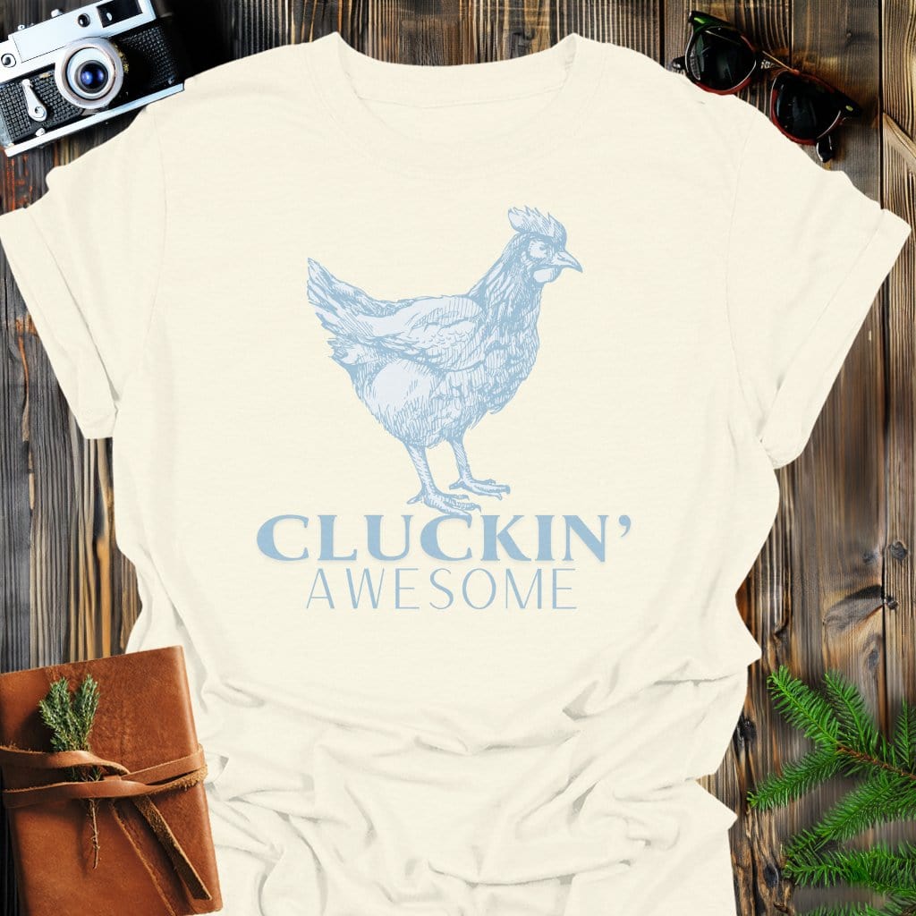 Cluckin' Awesome T-Shirt In Natural / S Lightweight adventure tee for outdoor lovers Perfect for hiking camping or road trips Made from soft breathable cotton for all-day comfort Ideal for nature lovers and adventurers FAYO Threads outdoor apparel remember Fun Awaits You Outside