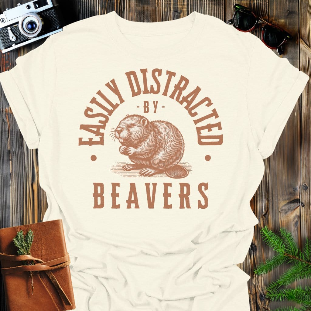 Distracted by Beavers T-Shirt In S / Natural Lightweight adventure tee for outdoor lovers Perfect for hiking camping or road trips Made from soft breathable cotton for all-day comfort Ideal for nature lovers and adventurers FAYO Threads outdoor apparel remember Fun Awaits You Outside