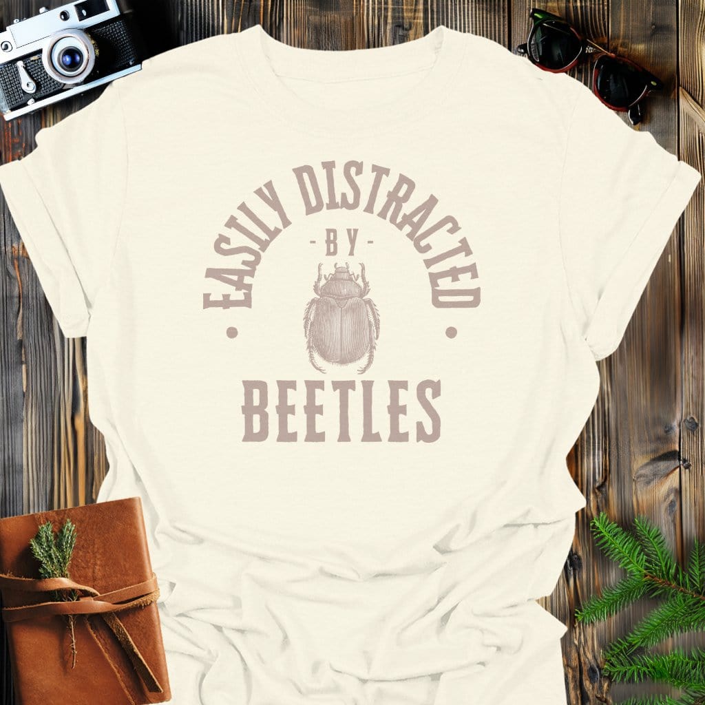 Distracted By Beetles T-Shirt In S / Natural Lightweight adventure tee for outdoor lovers Perfect for hiking camping or road trips Made from soft breathable cotton for all-day comfort Ideal for nature lovers and adventurers FAYO Threads outdoor apparel remember Fun Awaits You Outside