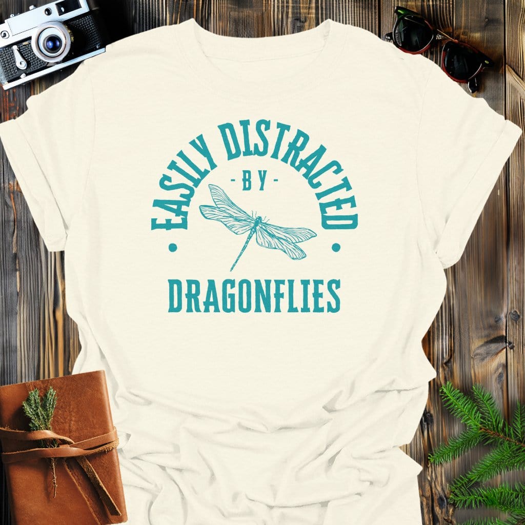 Distracted By Dragonflies T-Shirt In S / Natural Lightweight adventure tee for outdoor lovers Perfect for hiking camping or road trips Made from soft breathable cotton for all-day comfort Ideal for nature lovers and adventurers FAYO Threads outdoor apparel remember Fun Awaits You Outside