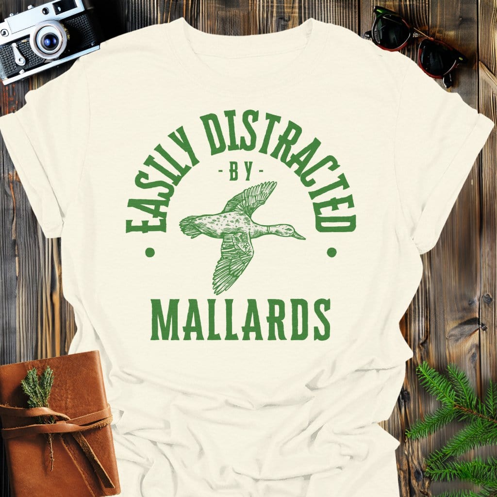 Distracted by Mallards T-Shirt In S / Natural Lightweight adventure tee for outdoor lovers Perfect for hiking camping or road trips Made from soft breathable cotton for all-day comfort Ideal for nature lovers and adventurers FAYO Threads outdoor apparel remember Fun Awaits You Outside